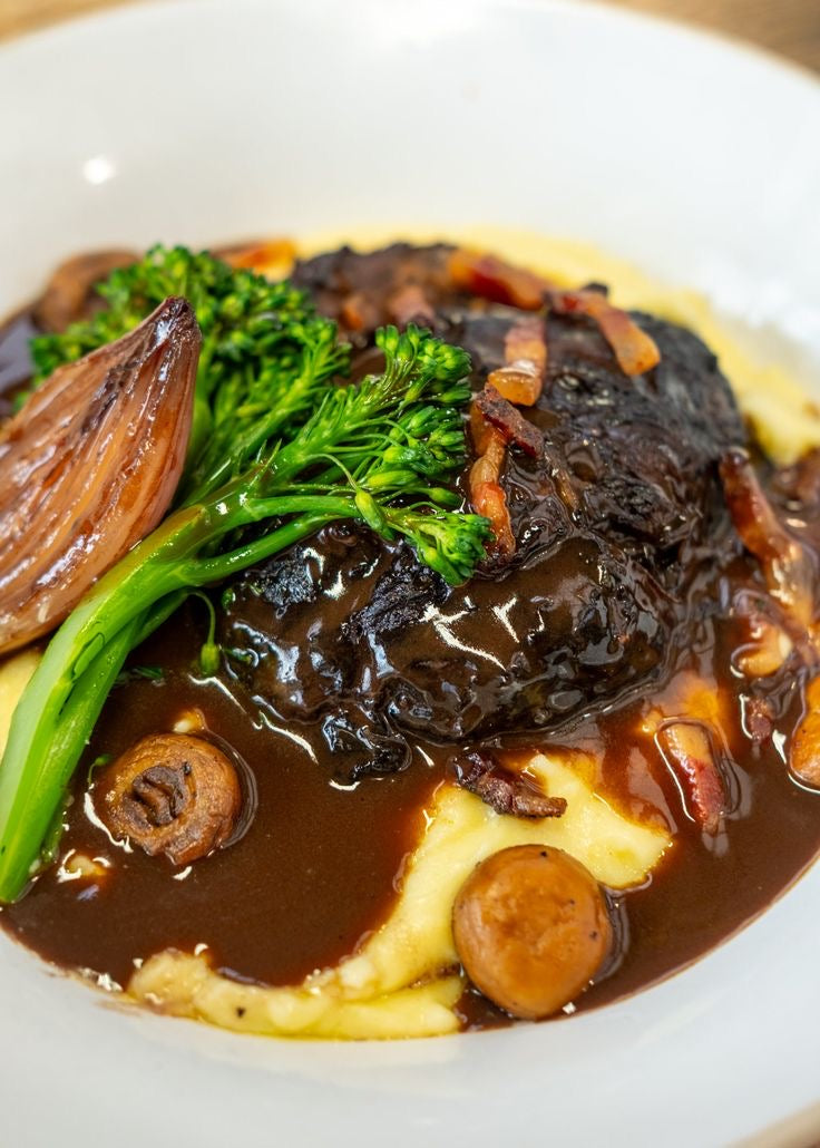 BRAISED BEEF CHEEK, WILD MUSHROOM AND BEEF JUS SAUCE, ROASTED GARLIC AND HERB POTATO PUREE