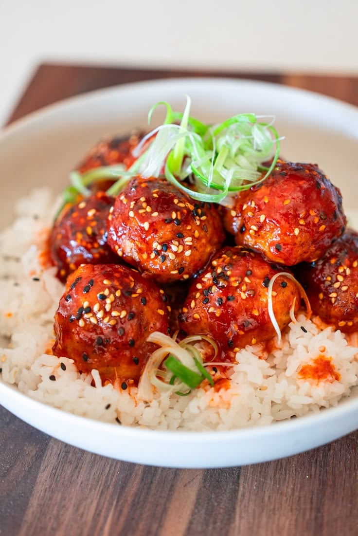 KOREAN INFUSED CHICKEN MEATBALLS, KOREAN GLAZE SESAME & BLACK ONION RICE