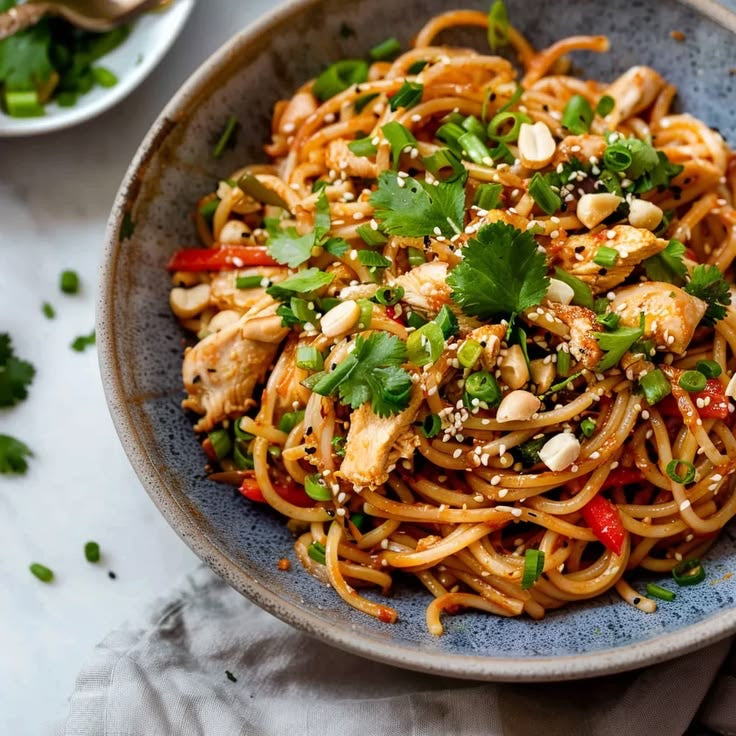 THAI PEANUT SESAME CHICKEN NOODLES